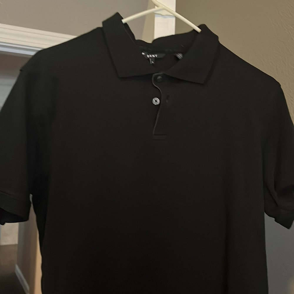 Nice black polo shirt still in good condition